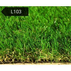 A close-up of lush green artificial grass with a label that says "L103." The grass blades appear soft and realistic.