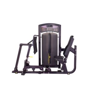 A seated leg press machine. It has a black frame with red and yellow accents, a padded seat, and adjustable foot pedals.