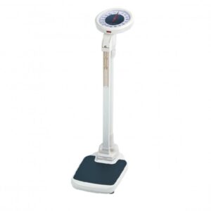 A white standing scale with a round analog dial. The scale has a tall, narrow base and a platform for standing.