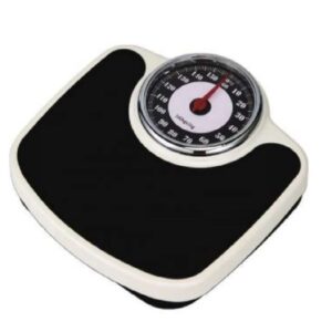 A round analog weighing scale with a black platform and a chrome frame. The scale has a dial with markings in kilograms and pounds. The dial reads "30" in both kilograms and pounds.