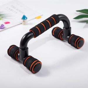 A pair of black push-up bars with orange accents. The bars have foam handles and a non-slip base.