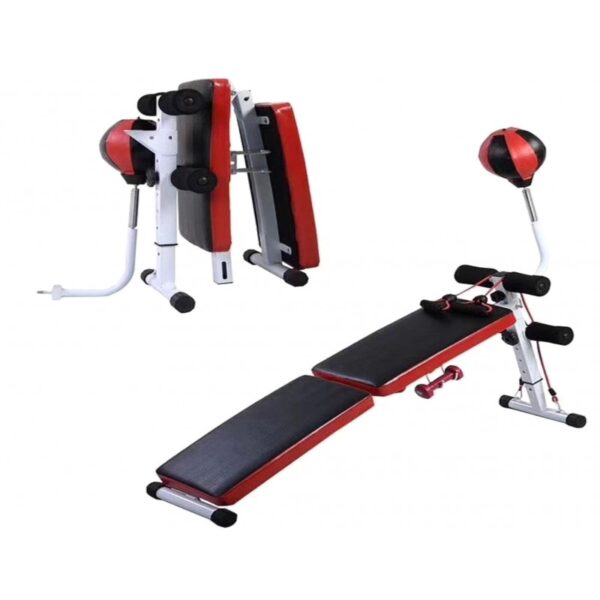 A foldable sit-up bench with a punching bag attached. The bench has a red and white frame and a black padded seat and backrest. The punching bag is also black and has a red stripe. The bench can be folded in half for storage.