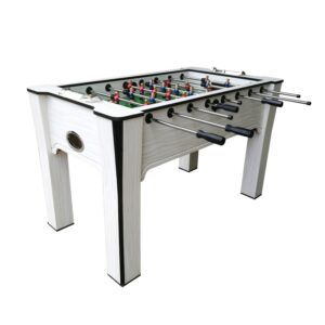 A white foosball table with a glass playing surface. The table has two sets of rods with figures, a ball, and a coin slot.