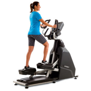 A gray Spirit Fitness CE900 Commercial Elliptical with a digital display, handles for support, and two foot pedals.