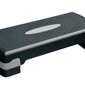 A black aerobic stepper with a gray platform on top. The stepper has a rectangular shape with rounded corners and a textured surface for grip.