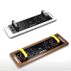 Two push-up boards with different colors. One board is white with black handles, and the other is brown with yellow handles. Both boards have a circular pattern with multiple levels of difficulty.