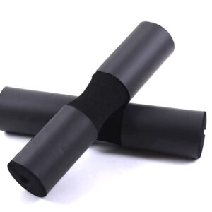 Two black foam barbell pads on a white background. The pads are cylindrical in shape and have a raised center section. They are designed to be placed on a barbell to provide padding and comfort during exercises like squats or bench presses.